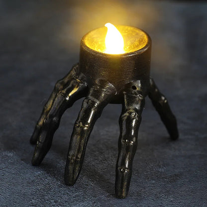 Close-up of the flickering LED flame on the Halloween tea light candle