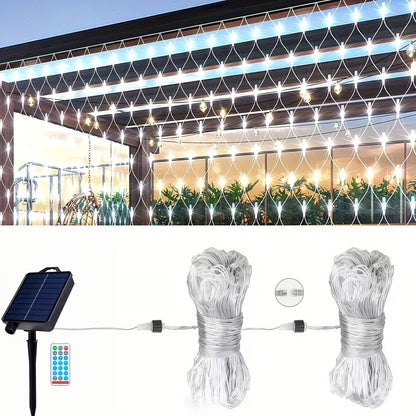 Solar net lights installed on a garden hedge