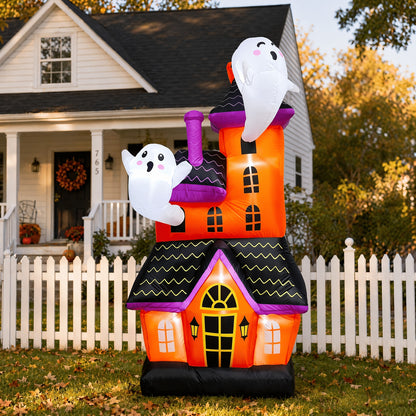 Large inflatable haunted house ghost castle decoration lit up in a yard - view 2