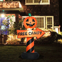 Inflatable pumpkin road sign lit up with LED lighting at night