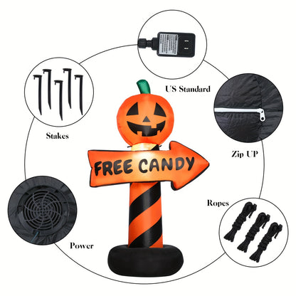 Inflatable pumpkin road sign glowing among other yard decorations