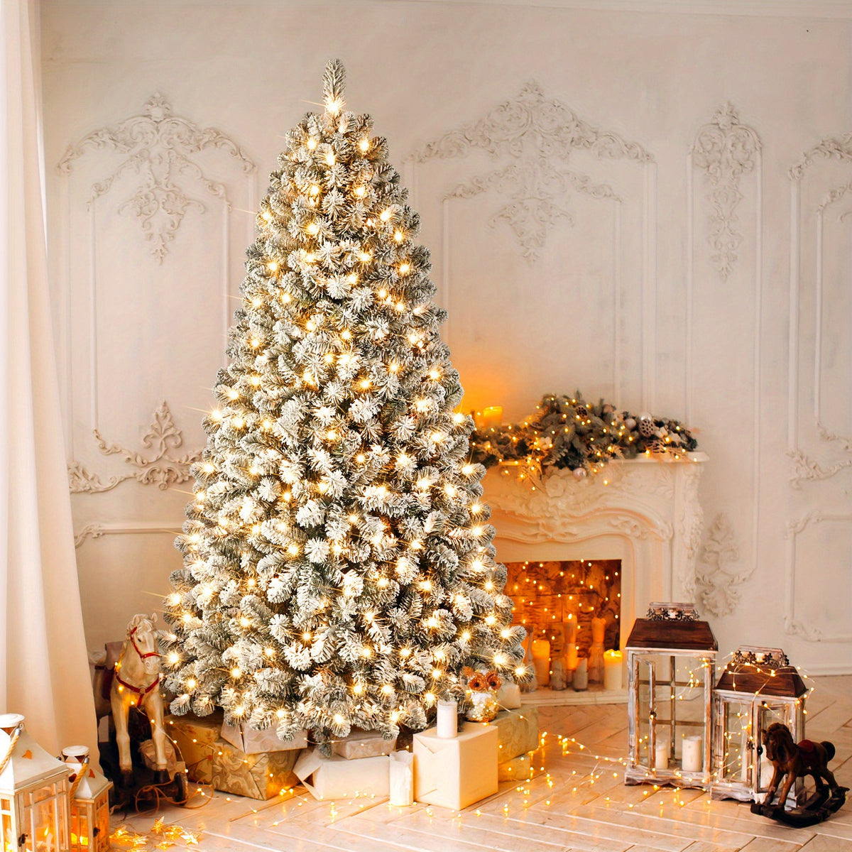 Pre lit white flocked Christmas tree glowing with warm lights