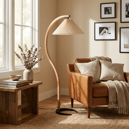 Caprani floor lamp with beige linen shade beside a reading chair