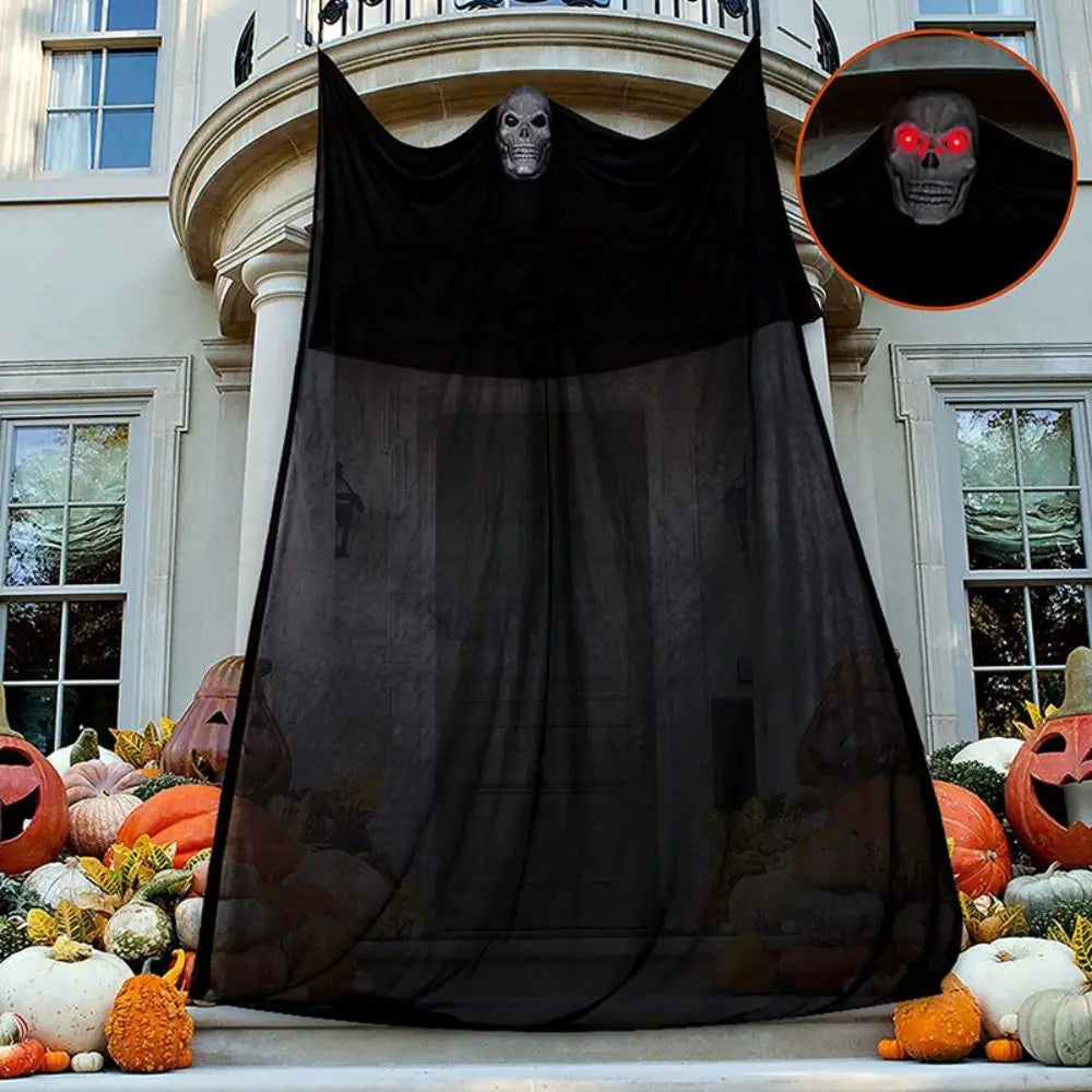Halloween ghost decoration hung on a porch
