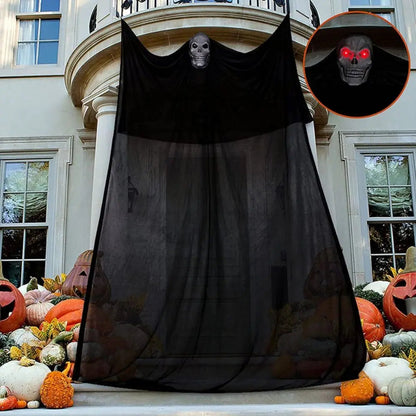 Halloween ghost decoration hung on a porch