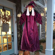 Hanging Halloween witch decoration with a gauze robe and glowing red eyes