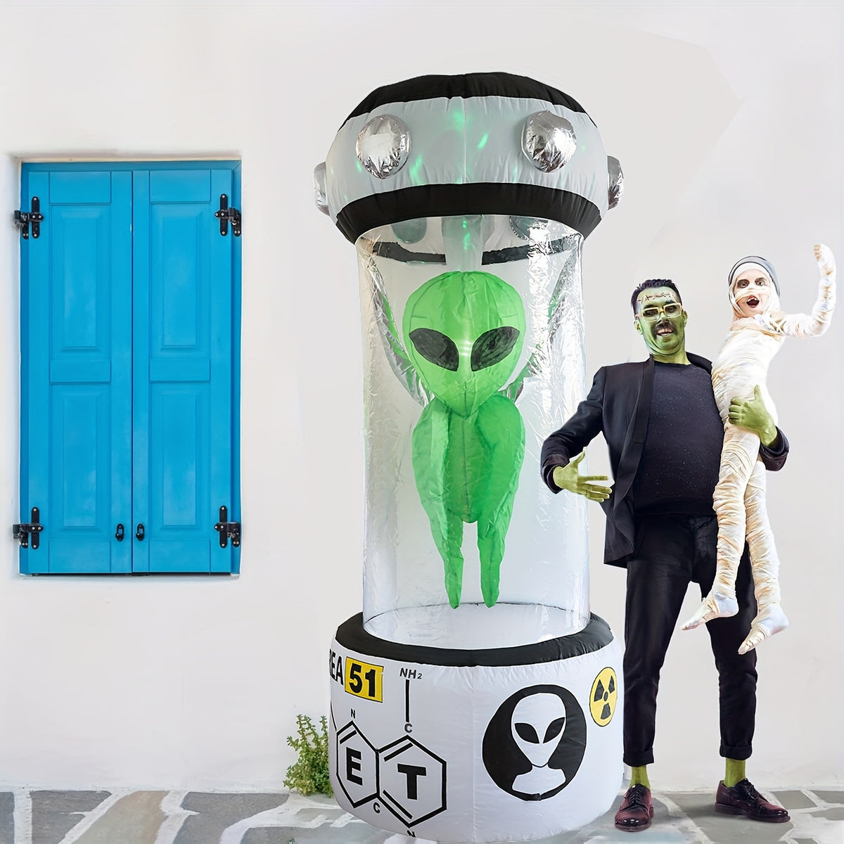 Green alien inflatable inside its capsule housing, additional view