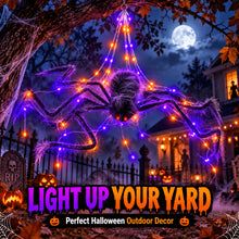 Halloween spider web net light glowing purple and orange across a house wall with a large plush spider