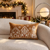 Embroidered gingerbread man and snowflakes on a coffee brown pillow cover