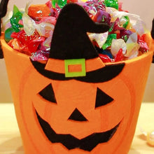 Halloween treat bags with seasonal candy bucket designs