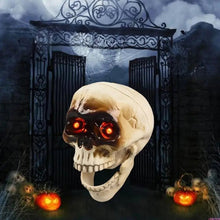 Animated Halloween skeleton head with glowing red eyes hanging on a door