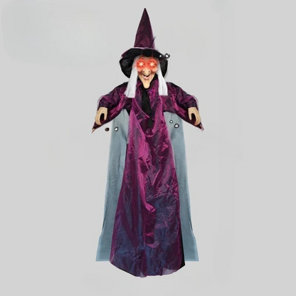 Purple and black costume detail on the animated witch prop