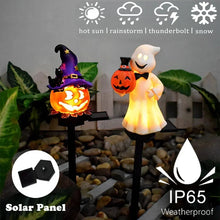 Halloween solar light ghost design staked in a yard