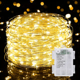 Copper wire fairy lights coiled and lit, tiny points of light along a thin wire