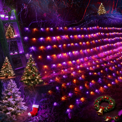 Orange and purple LED solar net lights draped over outdoor bushes for Halloween - view 3