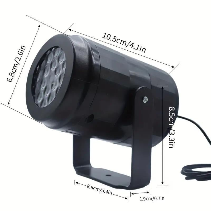 Halloween projector light shown next to its USB cable