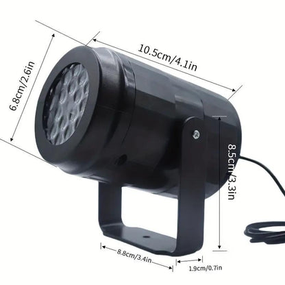 Halloween projector light shown next to its USB cable