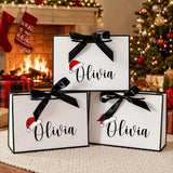 Personalized Christmas gift bag in paper with a hat shape and ribbon bow
