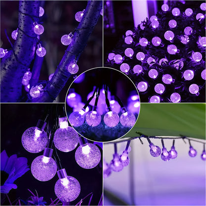 Purple LED solar bubble ball string lights wrapped around an outdoor tree - view 8