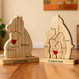 Three wooden bears on a base