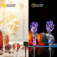 Close-up of skeleton hand solar light design