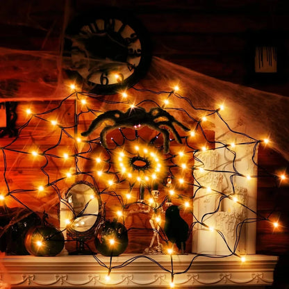 Halloween spider web decoration with lights displayed outdoors