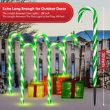 Candy cane pathway stake light, lit at night