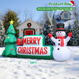 Inflatable Christmas sign with a snowman and tree