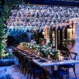 Icicle lights framing a wedding arch