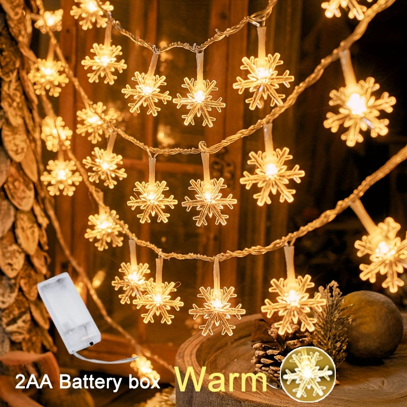 Snowflake lights on a small indoor Christmas tree