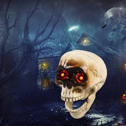Animated Halloween skeleton head mounted on a wall