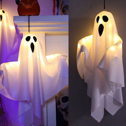 Hanging Halloween ghost decoration in a garden setting
