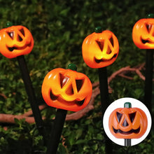 Solar pumpkin and ghost Halloween decor set glowing at night