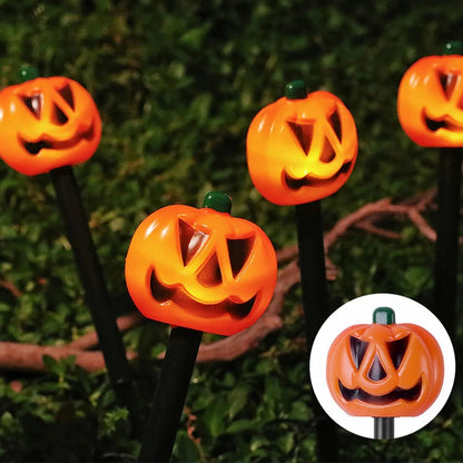 Solar pumpkin and ghost Halloween decor set glowing at night