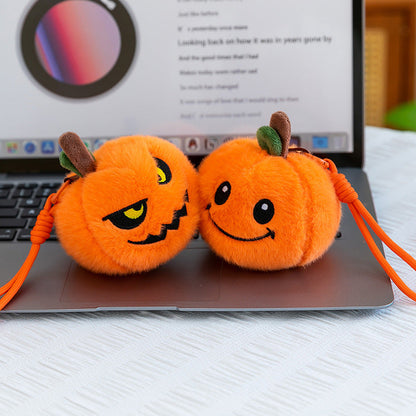 Pumpkin plush keychain attached to a set of keys