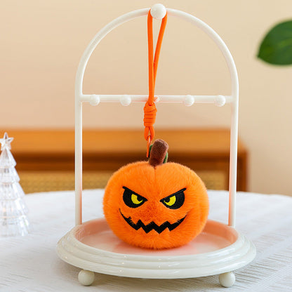Close-up of soft plush texture on pumpkin keychain