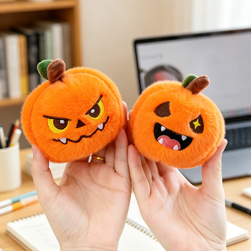 Five different pumpkin keychain expressions side by side