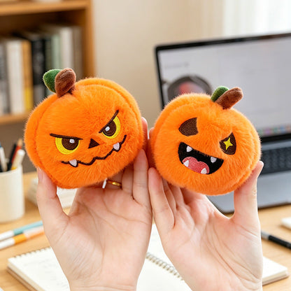 Five different pumpkin keychain expressions side by side