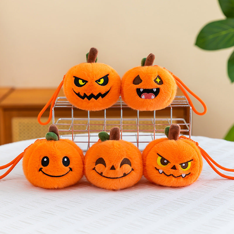 Pumpkin plush keychain attached to a backpack zipper