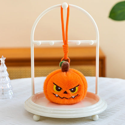Pumpkin plush keychain set laid out on a flat surface