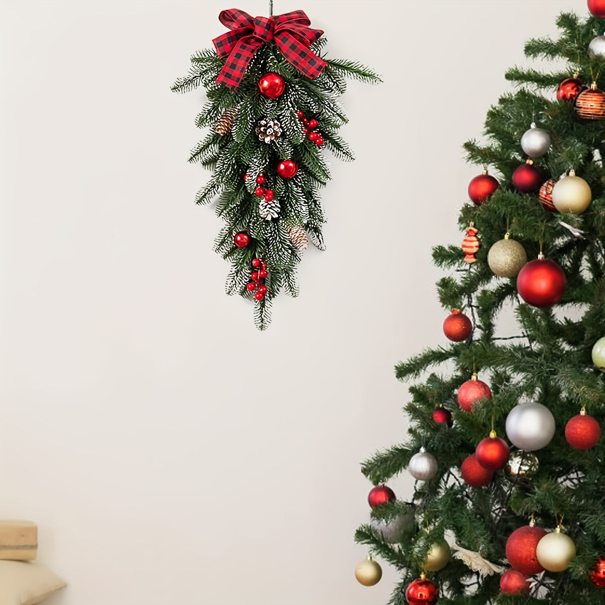 Pine cone and red berry accents on an artificial Christmas swag