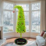 Green artificial Christmas tree and tree skirt for a holiday party