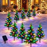 Stake lights along a driveway edge in the evening