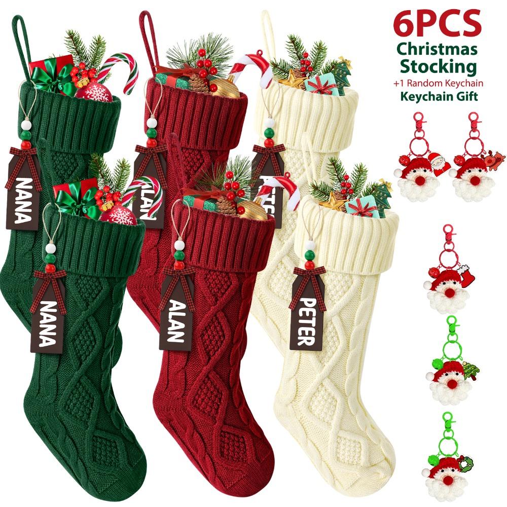 Six cable knit Christmas stockings in a row