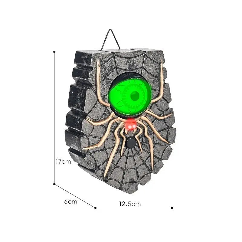 Spider eyeball Halloween doorbell prop installed on an entryway