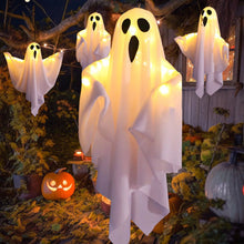 Hanging Halloween lighted ghost decoration glowing at night