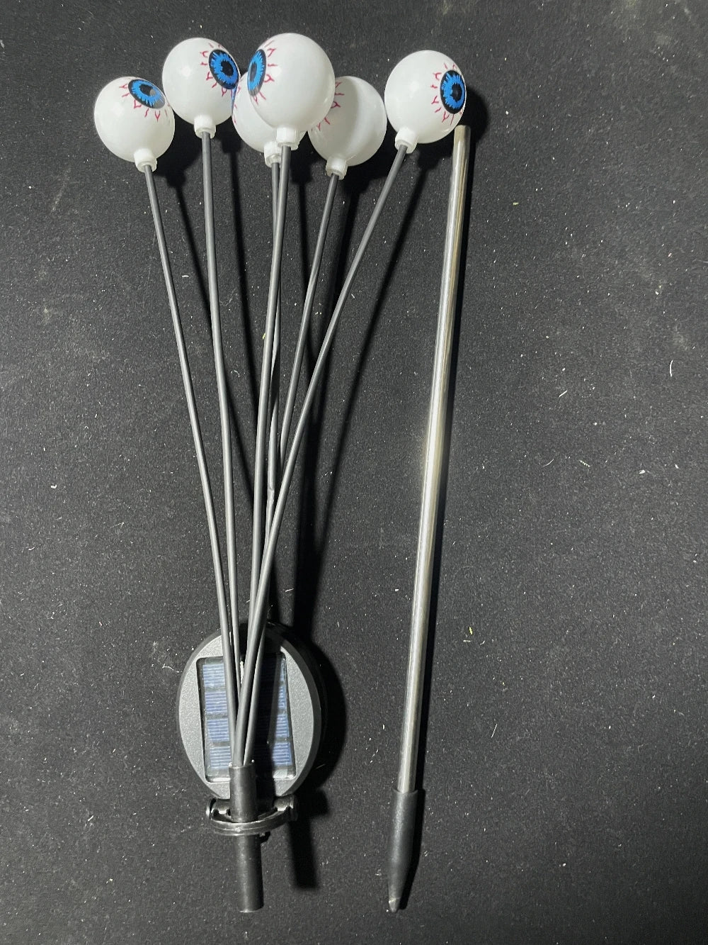 Solar eyeball lights during daytime showing the stake design