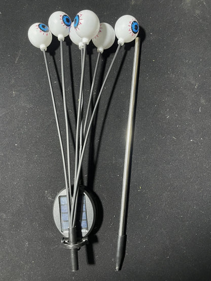 Solar eyeball lights during daytime showing the stake design