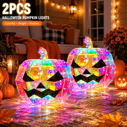 Two pumpkin lights grouped on an entryway table