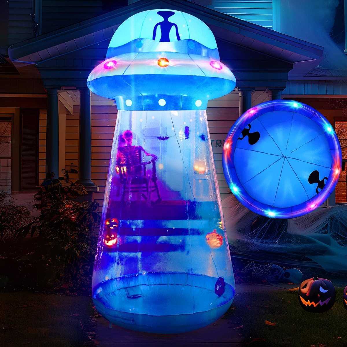 Inflatable UFO decoration glowing at night in a yard